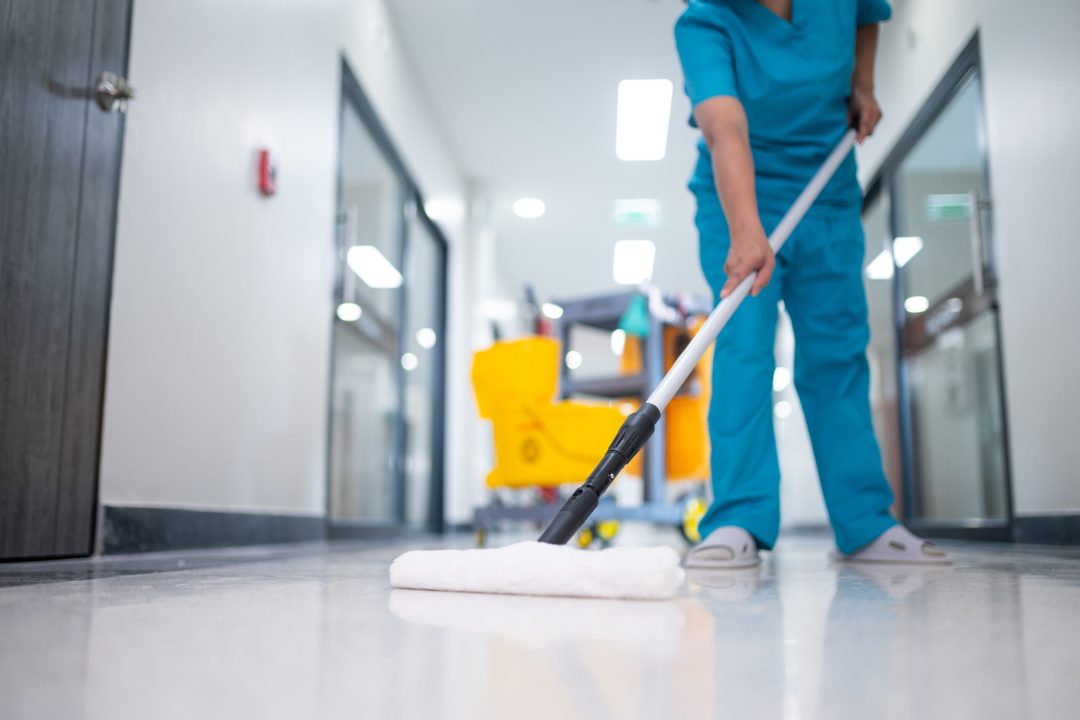 Cleaner using mops, cleaner with mop and uniform cleaning hall floor, hospital cleaning floor with mop in patient room the hospital epoxy floor